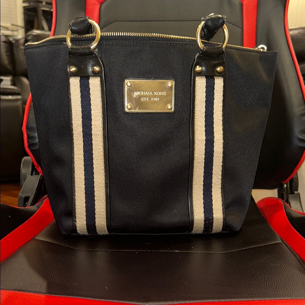 NWOT. Michael Kors Black and Tan Handbag with Gold Accents